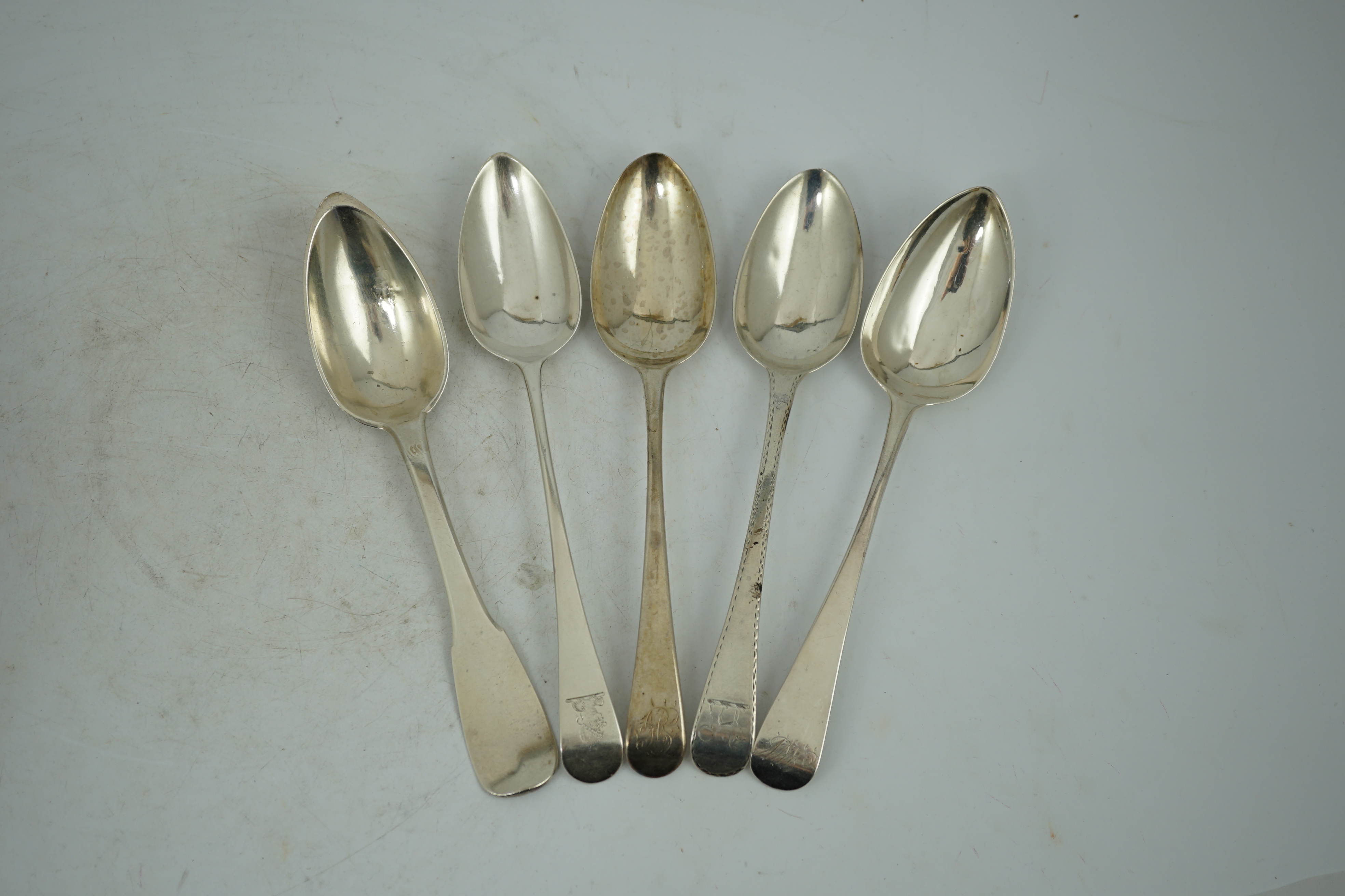 A harlequin collection of 18th and mainly 19th century silver Old English pattern table spoons, various dates and makers, forty five items, together with five similar fiddle pattern table spoons and two French white meta